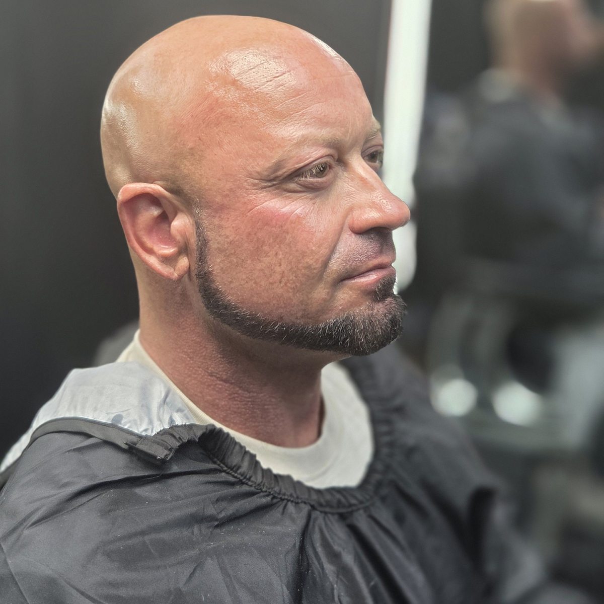 Finished beard shaping and close haircut