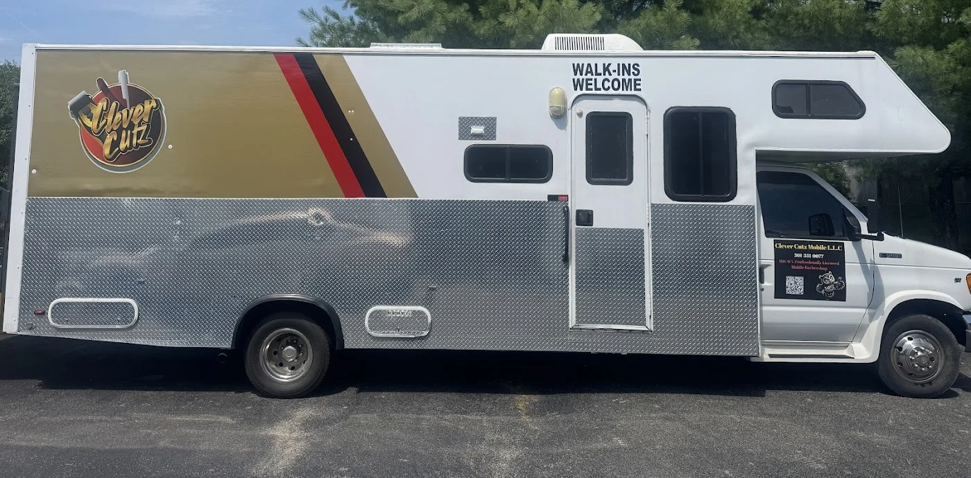 The Clever Cutz Mobile barbershop vehicle with its authentic red and gold branding
