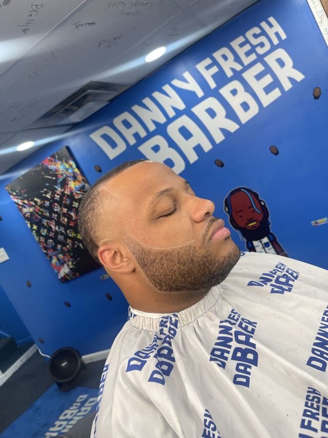 Close view of Danny Fresh's haircut and sharp hairline