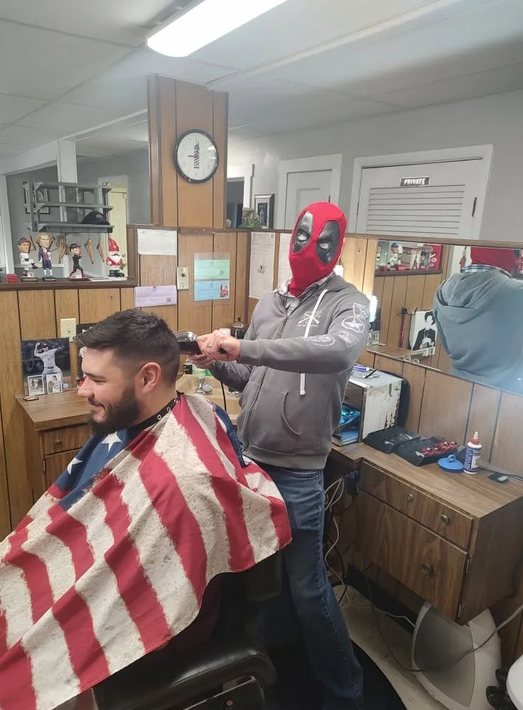 Barber working at Young's Barber Shop